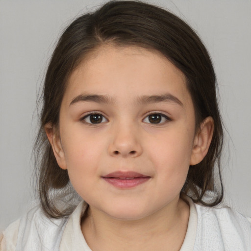 Joyful white child female with medium  brown hair and brown eyes