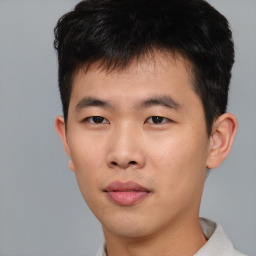 Neutral asian young-adult male with short  brown hair and brown eyes