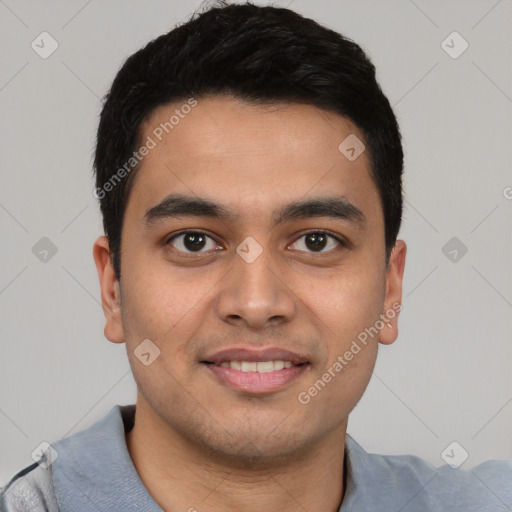 Joyful latino young-adult male with short  black hair and brown eyes