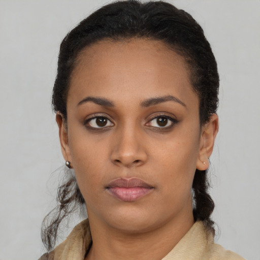 Neutral latino young-adult female with short  black hair and brown eyes