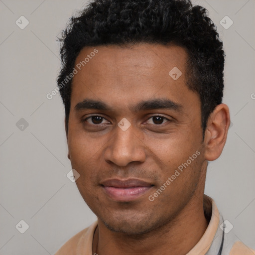 Joyful black young-adult male with short  black hair and brown eyes