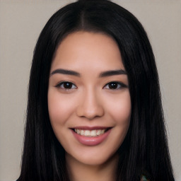 Joyful white young-adult female with long  black hair and brown eyes