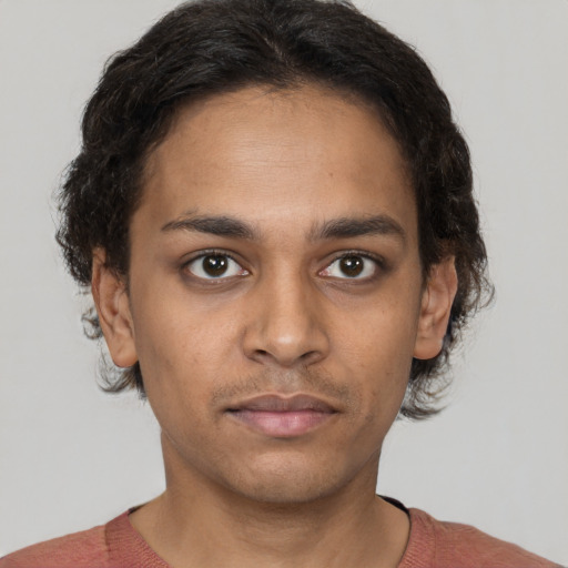 Neutral black young-adult male with short  brown hair and brown eyes