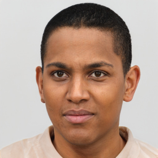 Joyful black young-adult male with short  brown hair and brown eyes