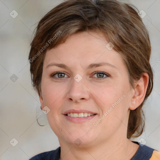 Joyful white young-adult female with medium  brown hair and blue eyes