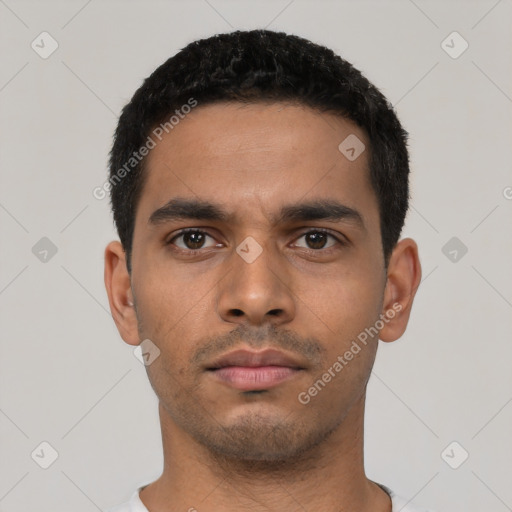 Neutral latino young-adult male with short  black hair and brown eyes