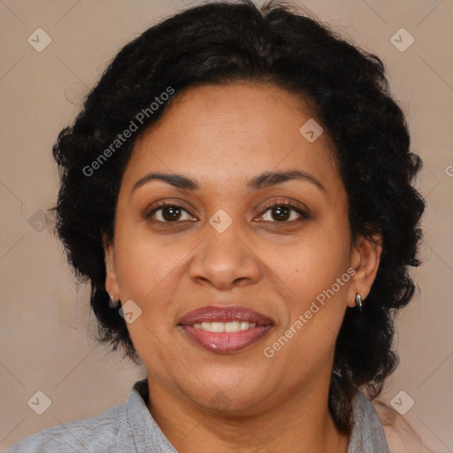 Joyful latino adult female with medium  brown hair and brown eyes