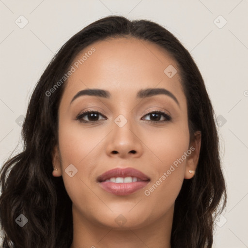 Joyful latino young-adult female with long  brown hair and brown eyes