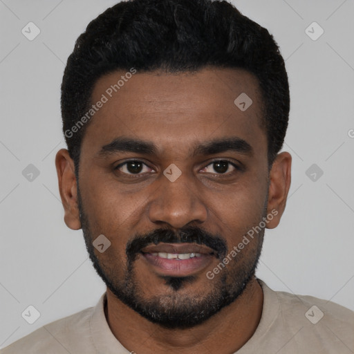 Joyful black young-adult male with short  black hair and brown eyes