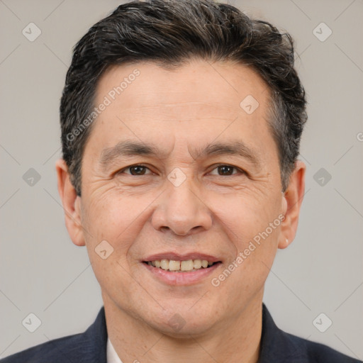 Joyful white adult male with short  brown hair and brown eyes