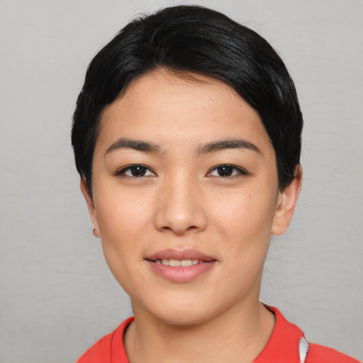 Joyful white young-adult female with short  black hair and brown eyes