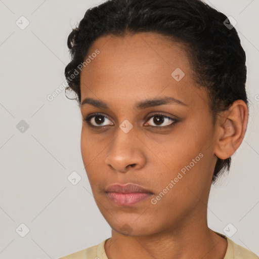 Neutral black young-adult female with short  brown hair and brown eyes