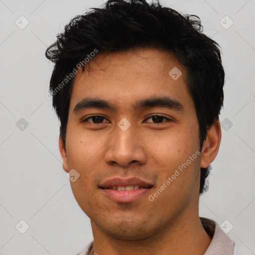 Joyful asian young-adult male with short  black hair and brown eyes