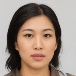 Neutral asian young-adult female with medium  black hair and brown eyes