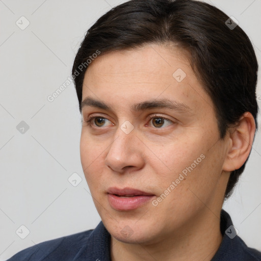 Joyful white adult male with short  brown hair and brown eyes