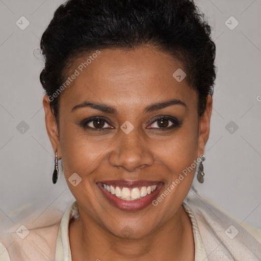 Joyful black young-adult female with short  brown hair and brown eyes