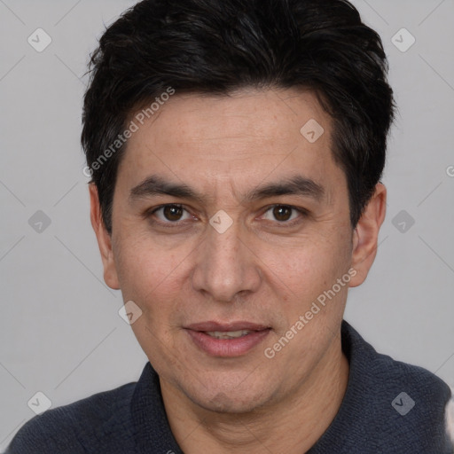 Joyful white adult male with short  black hair and brown eyes