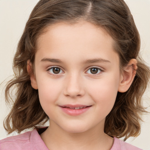 Joyful white child female with medium  brown hair and brown eyes