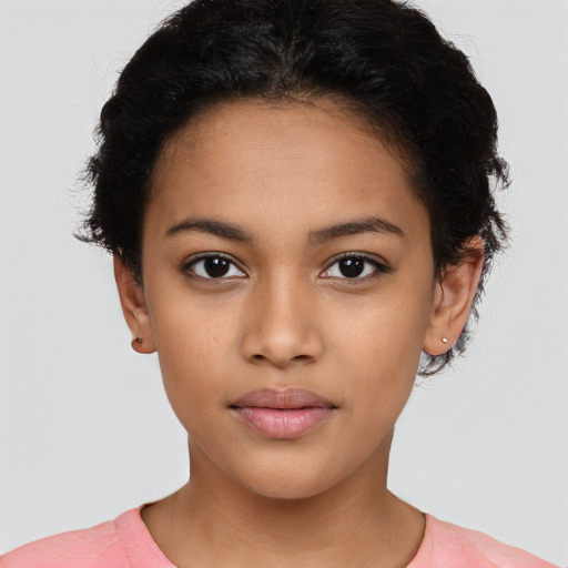 Joyful latino young-adult female with short  black hair and brown eyes