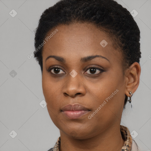 Joyful black young-adult female with short  brown hair and brown eyes