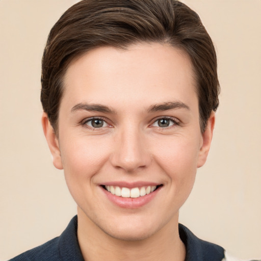 Joyful white young-adult female with short  brown hair and brown eyes