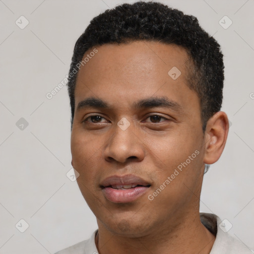 Joyful black young-adult male with short  black hair and brown eyes