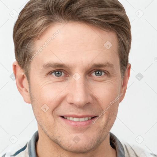 Joyful white adult male with short  brown hair and grey eyes