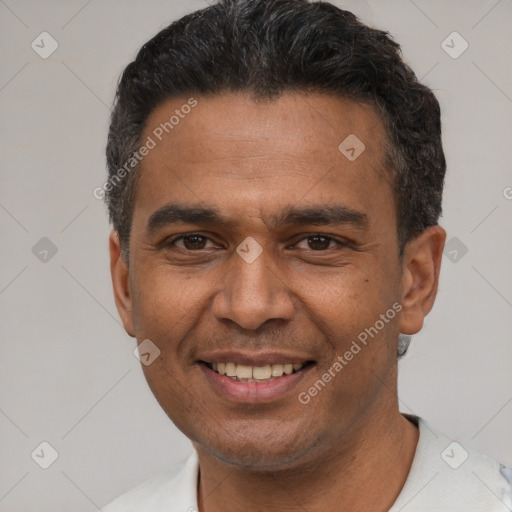 Joyful latino adult male with short  black hair and brown eyes