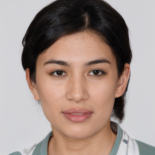 Joyful white young-adult female with medium  black hair and brown eyes