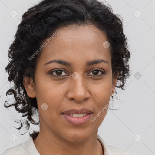 Joyful black young-adult female with long  brown hair and brown eyes