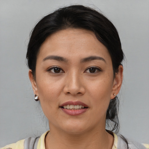 Joyful white young-adult female with short  black hair and brown eyes