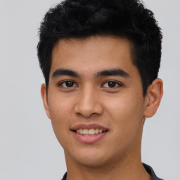 Joyful asian young-adult male with short  black hair and brown eyes