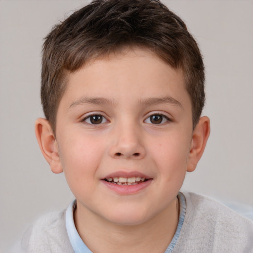 Joyful white child male with short  brown hair and brown eyes