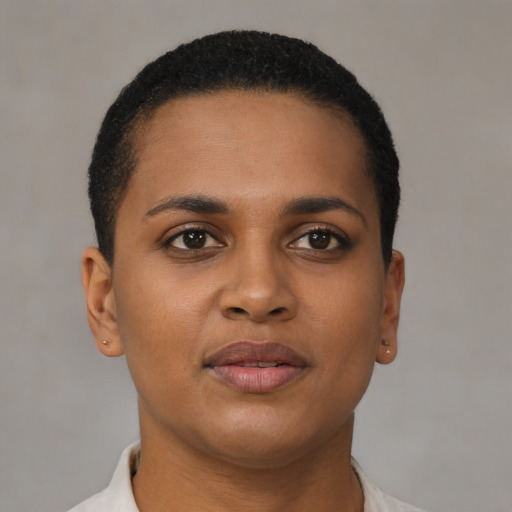 Joyful black young-adult female with short  brown hair and brown eyes