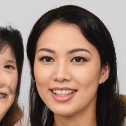 Joyful asian young-adult female with medium  black hair and brown eyes