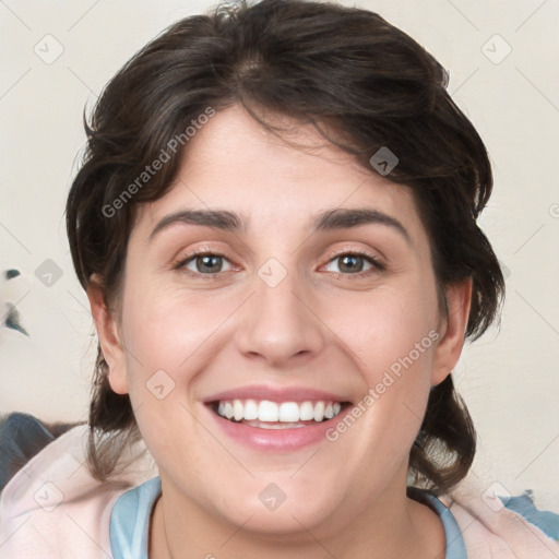 Joyful white young-adult female with medium  brown hair and blue eyes