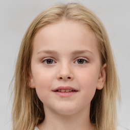 Joyful white child female with medium  brown hair and brown eyes