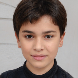 Joyful white child male with short  brown hair and brown eyes