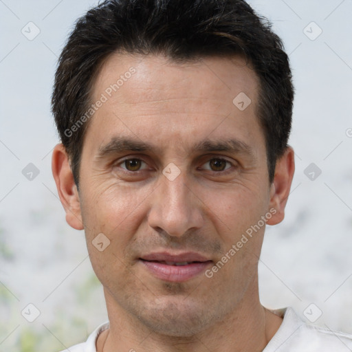 Joyful white adult male with short  brown hair and brown eyes