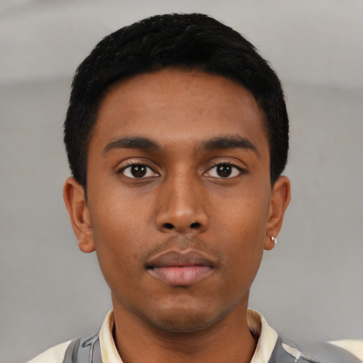 Neutral latino young-adult male with short  black hair and brown eyes