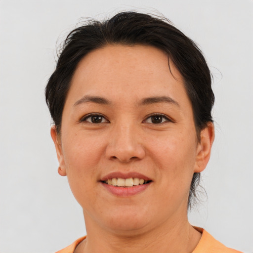 Joyful white adult female with short  brown hair and brown eyes