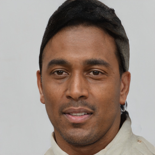 Neutral black young-adult male with short  black hair and brown eyes