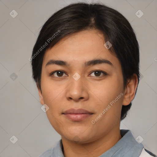 Joyful latino young-adult female with medium  black hair and brown eyes