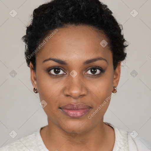 Joyful black young-adult female with short  black hair and brown eyes