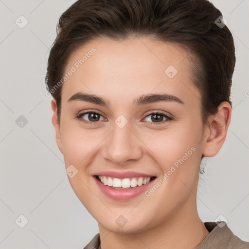 Joyful white young-adult female with short  brown hair and brown eyes