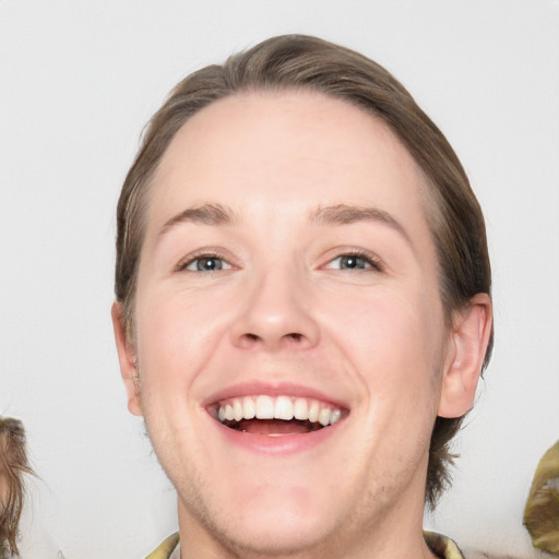 Joyful white adult male with medium  brown hair and brown eyes