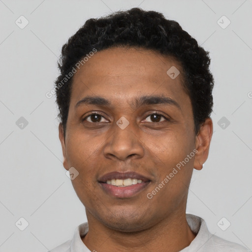 Joyful black young-adult male with short  black hair and brown eyes
