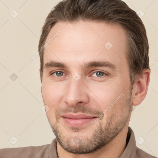 Joyful white young-adult male with short  brown hair and brown eyes