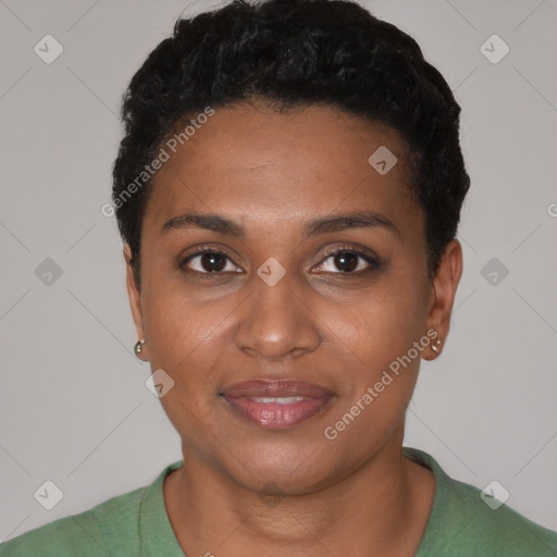 Joyful black young-adult female with short  black hair and brown eyes