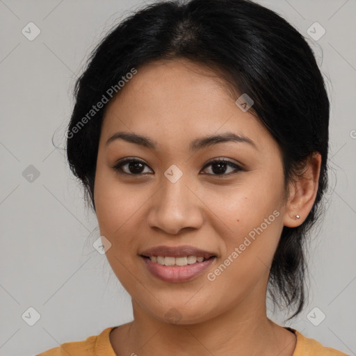 Joyful latino young-adult female with medium  brown hair and brown eyes